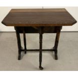 An antique small Sutherland table with turned legs and supports with original ceramic casters.