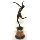A large Art Deco style bronze figurine of a dancing girl mounted on circular marble plinth.