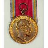 Mecklenburg-Schwerin: Bronzene Verdienstmedaille (1872-1918).Bronze, dazu Bandstück.Zustand: II