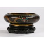 Cloisonné bowl and stand , the black ground decorated with a dragon chasing a pearl, raised on a