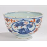 Japanese porcelain tea bowl, Edo period, with red and blue flowers to the body and buildings