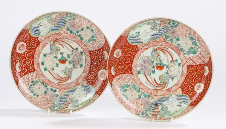 Pair of Japanese Meiji period porcelain plates, the centre of each with two birds and flowers within