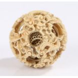 Chinese Canton carved ivory puzzle ball, Qing dynasty, 19th Century, with an outer dragon and