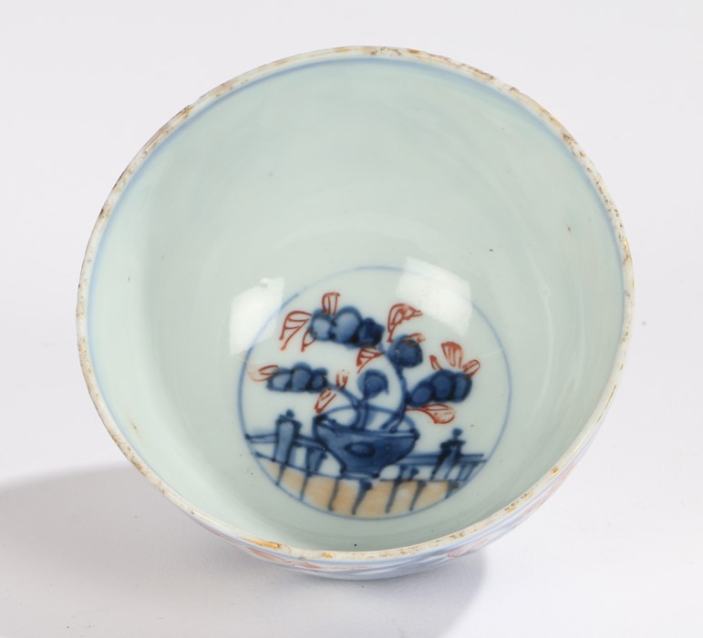 Japanese porcelain tea bowl, Edo period, with red and blue flowers to the body and buildings - Image 2 of 2