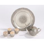 Vietnamese white metal tea set, to include a tea pot of small proportions, four tea bowls and a