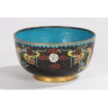 Chinese cloisonné bowl, with a blue interior and trailing dragons to the outside on a black