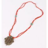 Tibetan necklace, with coral and turquoise beads above the pendant, 67cm longOverall good order, the