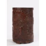 Chinese bamboo brush pot, Qing dynasty, carved with a mountainous landscape with trees, 17cm high