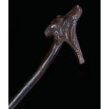 Japanese Meiji walking stick, the handle carved with a bird and mask above a natural cane, 99cm