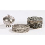 Three white metal boxes, to include a Tibetan example, another box and a filigree box, (3)