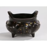Chinese bronze gold splash ting, with arched handles above a petal gold splash effect body on