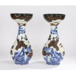 Pair of Chinese porcelain and lacquer vases, with black wide rims decorated with gilt scrolls
