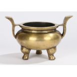 Chinese brass ting, with arched handles to the squat bowl above dumpy cabriole legs, six character