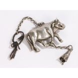 Chinese white metal amulet, of a cow walking with a chain drop, the cow 52mm longThe drop tassel