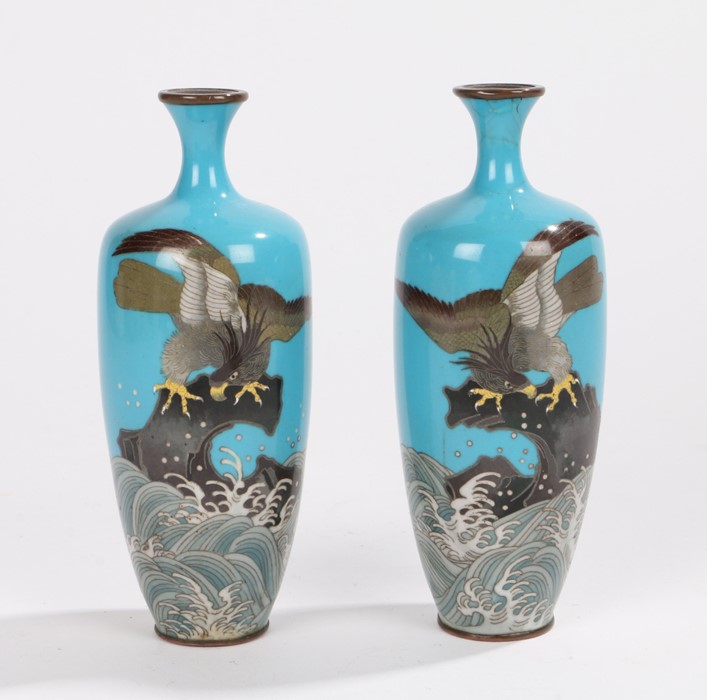 Pair of Japanese cloissone vases, with an eagle standing on a rock above a scrolling sea, 15cm high,