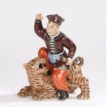 Chinese pottery figure, with a Chinese figure above a tiger with mouth wide open, 18cm lonhOverall