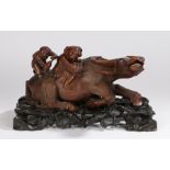 Chinese hardwood buffalo, the reclining buffalo with glass eyes and figures on the back, raised on a