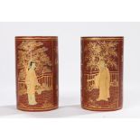 Pair of Chinese lacquer brush pots, in red lacquer with gilt characters and figural scenes, 12.5cm