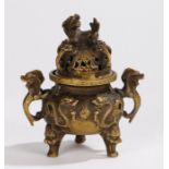 Chinese censer, with a dog of foo above a pierced lid and beast mounts, the squat base with arched