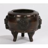 Chinese bronze censer, Qing dynasty, with dragon roundels to the body and fan handles above the