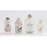 Four Chinese glass snuff bottles, the first with roosters among foliate trees, the second with