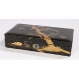 Japanese Meiji period lacquer box, decorated with raised gilt lacquer storks flying by a tree,