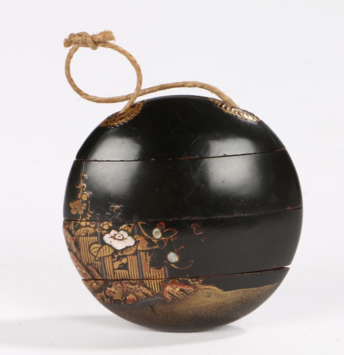 Japanese three case lacquered inro, of circular form decorated with gilt pagodas and mother of pearl