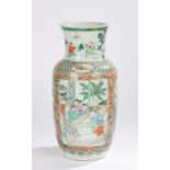 Chinese porcelain famille verte vase, the top with figures standing in a garden above the