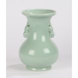 Chinese celadon porcelain vase, Qing dynasty, possibly 18th Century, with a flared rim above beast