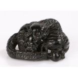 Japanese carved netsuke, of a coiled dragon signed to the base, 4.7cm diameter