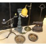 Works of art, to include an iron candleholder, a cow door stop, a candle stick, a lamp and a pair of
