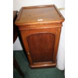 Edwardian mahogany pot cupboard, with three- quarter upstand above an arched panelled cupboard door,