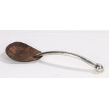 Continental spoon, the curved silver handle with orb form finial and shaped polished coconut bowl,