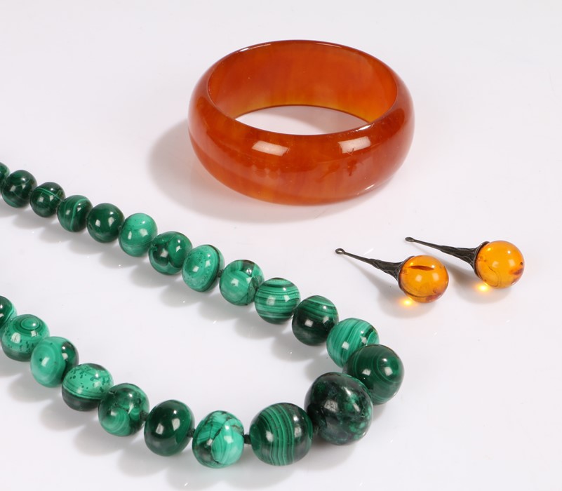 Graduated malachite bead necklace, pair of white metal and amber effect pendants, amber effect