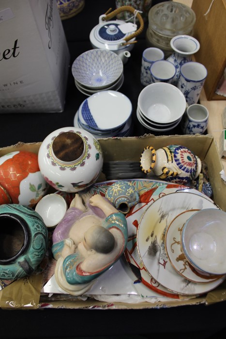 Contemporary Chinese porcelain, to include a teapot and cups with dishes and further bowls to also