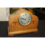 Edwardian striking mantle clock, with an arched top above an inlaid front and silvered dial