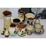 Collection of Torquay pottery motto ware, to include vases, jugs, cups and saucers etc (qty)