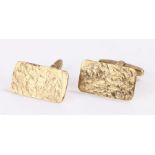 Pair of 8 carat gold cufflinks, with rectangular bark effect ends, 6.3g