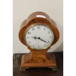 Mahogany mantel clock, the case of waisted form with a signed white dial and Roman hours