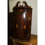 Mahogany and satinwood inlaid hanging corner cabinet, with fan inlay and bow cupboard doors, 91cm