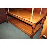 Pine coffee table, on turned legs united by a flattened undertier, 106cm x 51cm