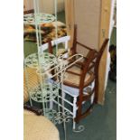 Green painted metal four-tier stand, scrolled metal towel rack, two bedroom chairs, two wall