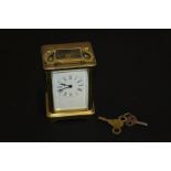 Jackson Paris brass carriage clock, with a signed white enamel dial