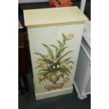 Pine cupboard with painted floral urn decorated doors opening to reveal interior shelves, on a