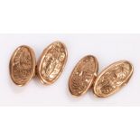 Pair of 9 carat gold cufflinks, the oval disk ends with foliate decoration, 2.4g