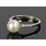 White metal pearl set ring, the pearl at 7.2mm held between the white metal shank, ring size I