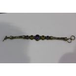 Silver bracelet set with amethysts and citrine type stones, 37.7g