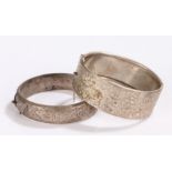 Two silver bangles with scroll decoration, 2.1oz