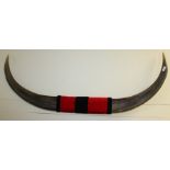 Set of bull horns, with red and black central band, 121cm wide