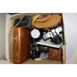 Two pairs of binoculars, broen leather cased gentleman's vanity set, Zenit B and Minolta cameras